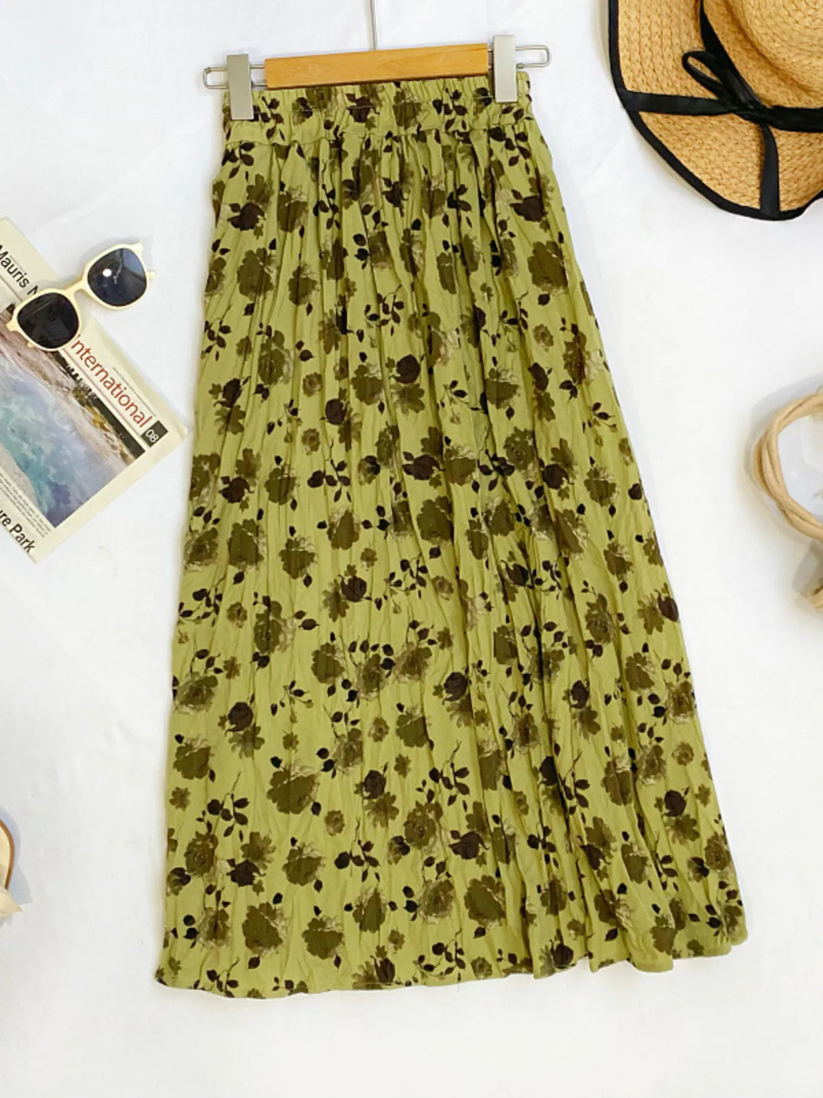 Floral print elastic waist midi skirt by Plush Fashion Hub, featuring a flowy design and vibrant flower patterns.