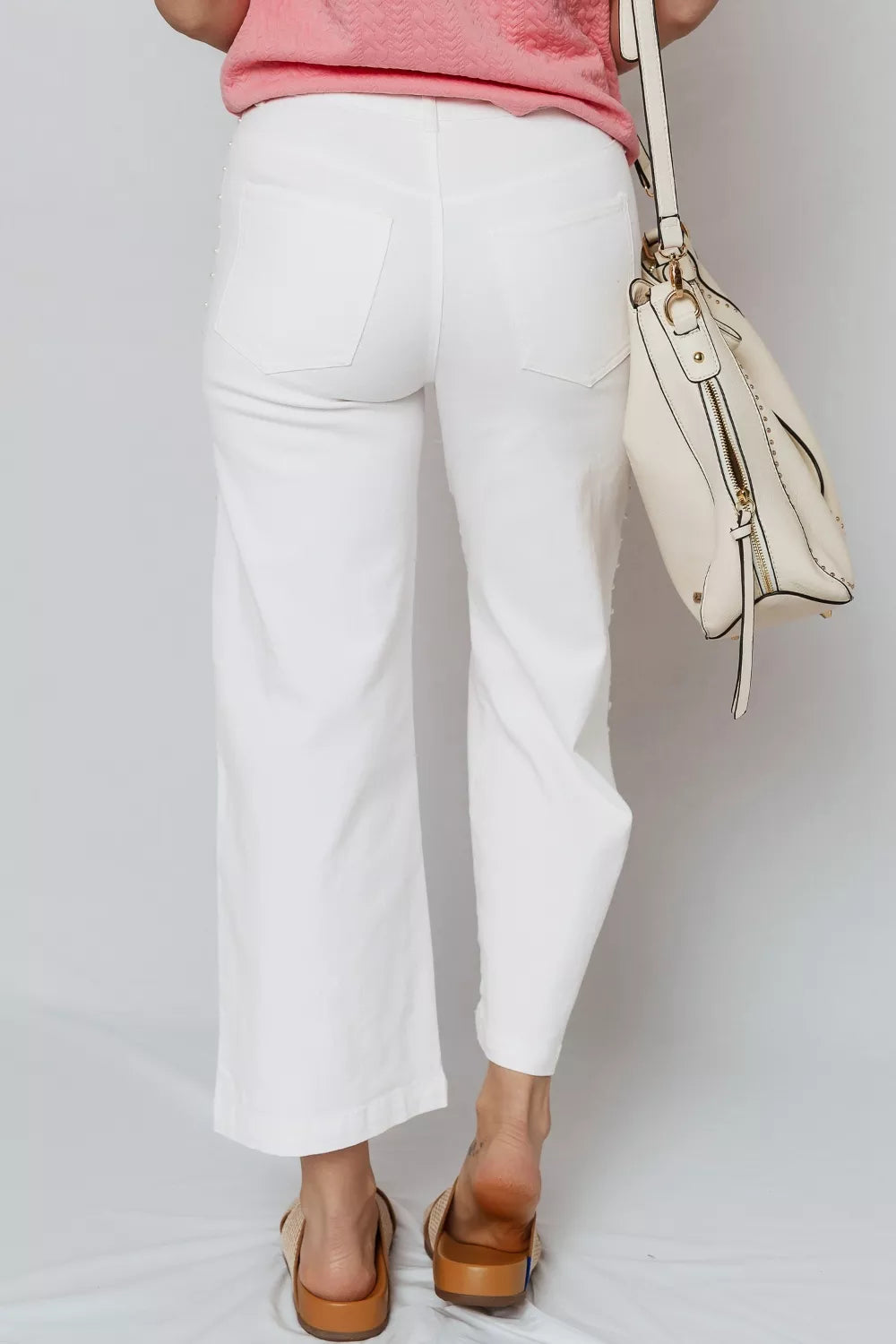 Pearl-embellished ankle-length shift jeans with side seams from Plush Fashion Hub, showcasing stylish denim design and pearl accents.