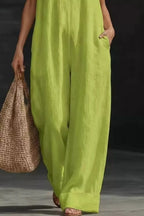 Women's sleeveless wide-leg jumpsuit with pockets from Trendsi, casual chic romper with a relaxed fit and stylish design.