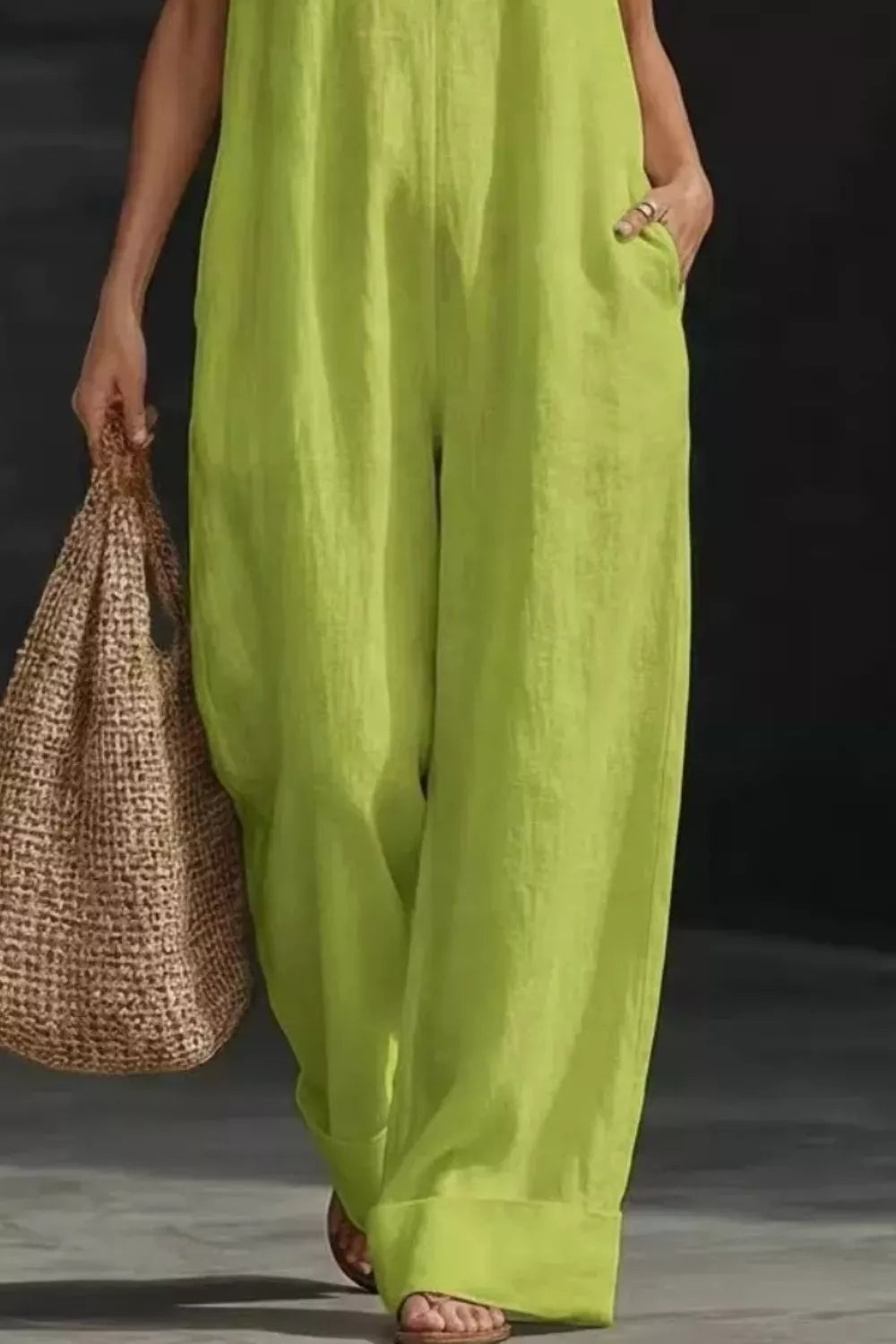 Women's sleeveless wide-leg jumpsuit with pockets from Trendsi, casual chic romper with a relaxed fit and stylish design.