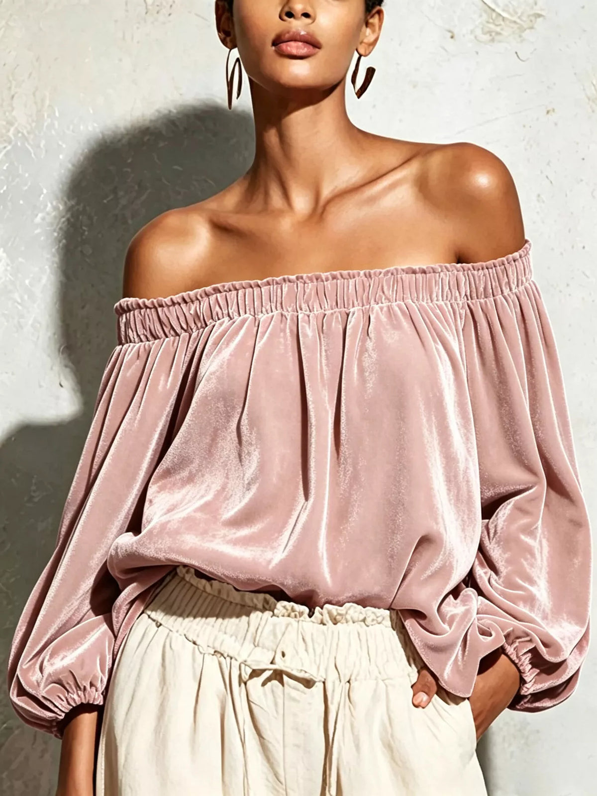 Off-shoulder velvet long sleeve T-shirt by Trendsi, featuring a stylish off-shoulder design and soft velvet fabric.