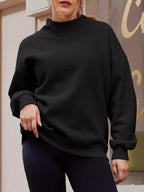 Women's oversized mock neck dropped shoulder sweatshirt in casual style, featuring a cozy pullover design and relaxed fit.