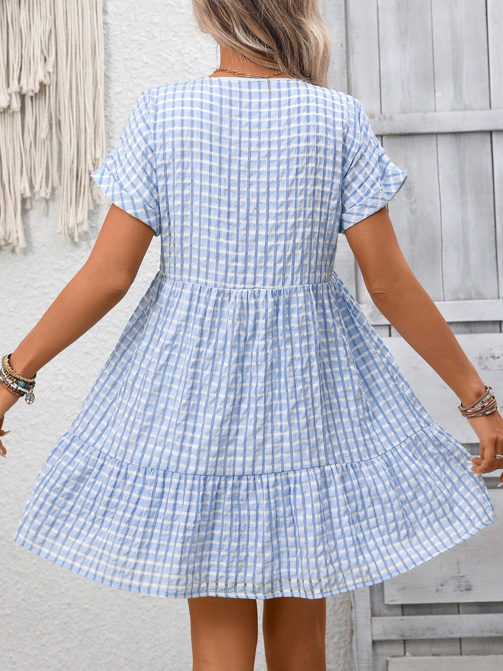 Plush Fashion Hub chic plaid V-neck mini dress with ruffle hem, lightweight and perfect for seasonal fashion styling.