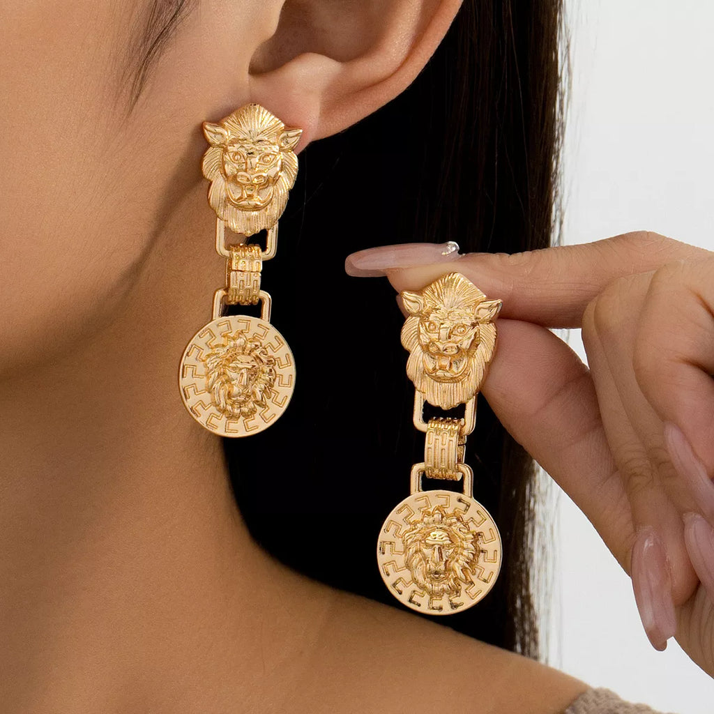 18K gold-plated lion head medallion drop earrings with detailed 3D lion design and elegant hanging style.