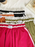 Lace trim elastic waist mini skirt in black with a fitted design and lightweight fabric, perfect for casual or dressy outfits.