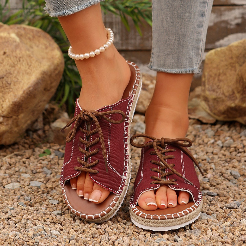 Women's lace-up open toe flat sandals in faux leather with ankle ties, stylish and comfortable footwear from Trendsi.