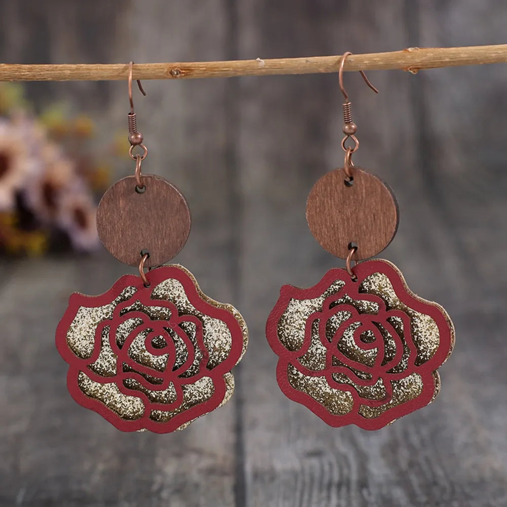 Wooden alloy rose-shaped dangle earrings from Plush Fashion Hub, featuring intricate floral design and elegant hanging style.