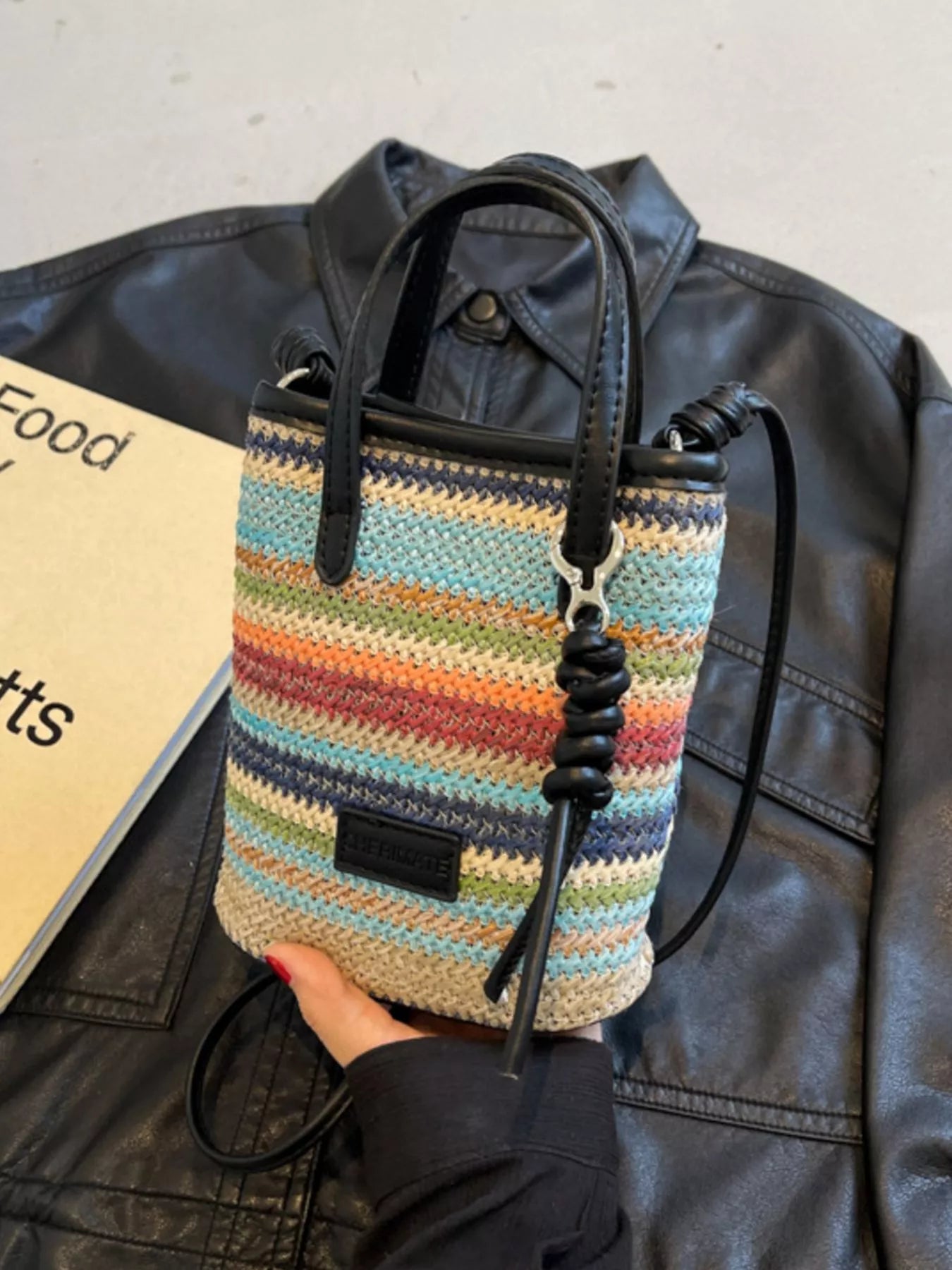 Striped woven mini crossbody bag by Trendsi featuring a compact design with adjustable strap and colorful striped pattern.