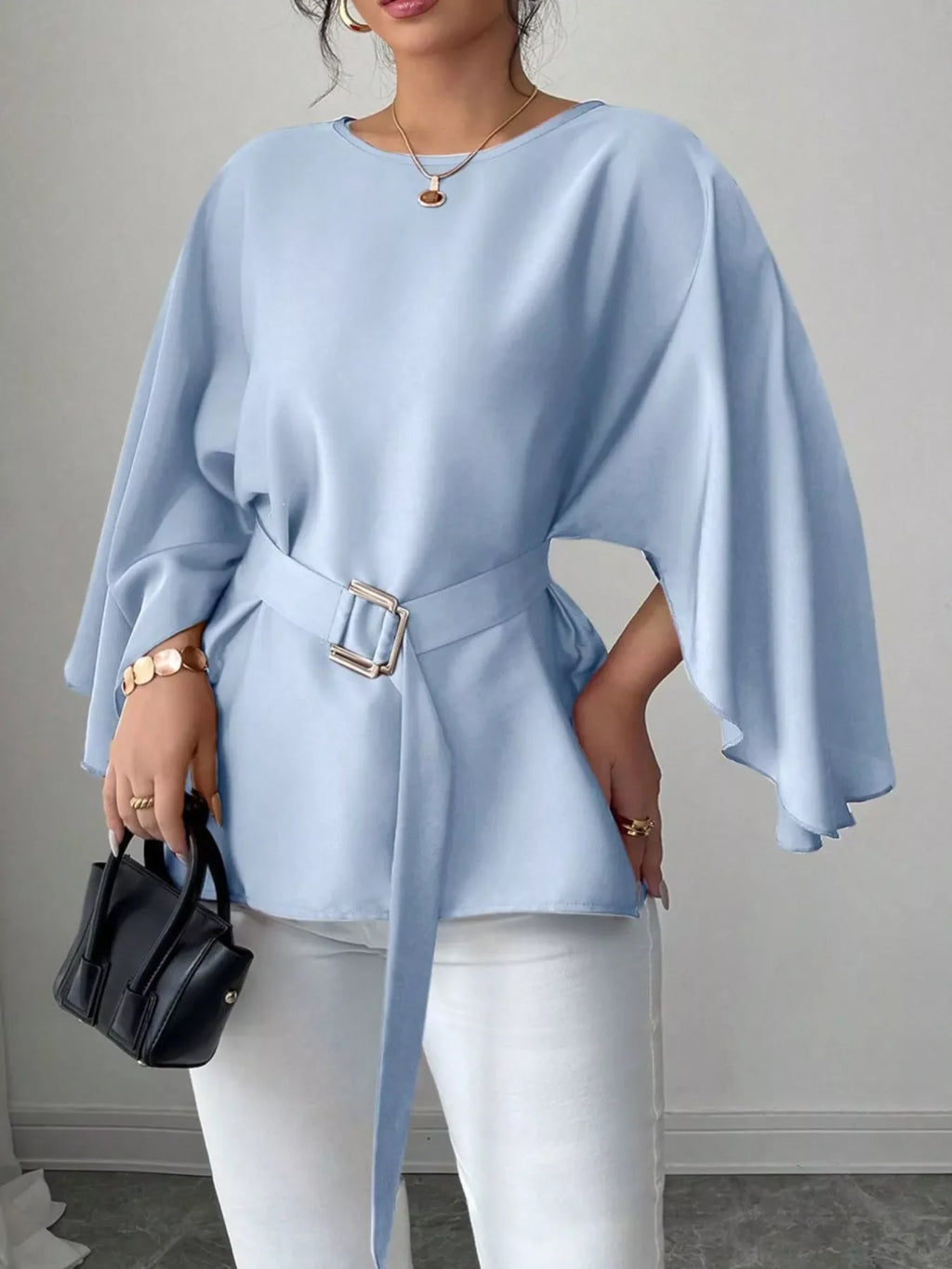 Black batwing sleeve belted blouse from Shopimist featuring a relaxed fit and stylish design, displayed on a hanger.