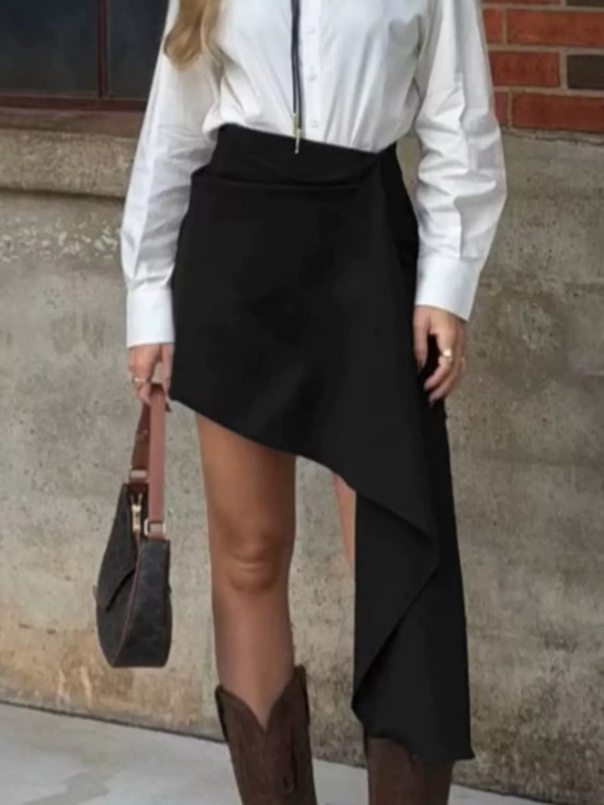Asymmetric high-waisted draped mini skirt in black from Trendsi, featuring a stylish, modern design and fitted waist.