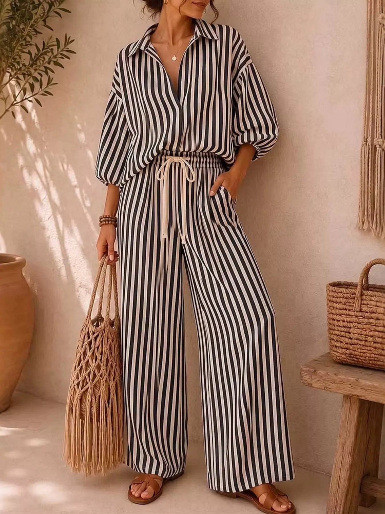 Plus size striped puff sleeve shirt and wide-leg drawstring pants set by Trendsi, showing the stylish matching outfit and fabric details.