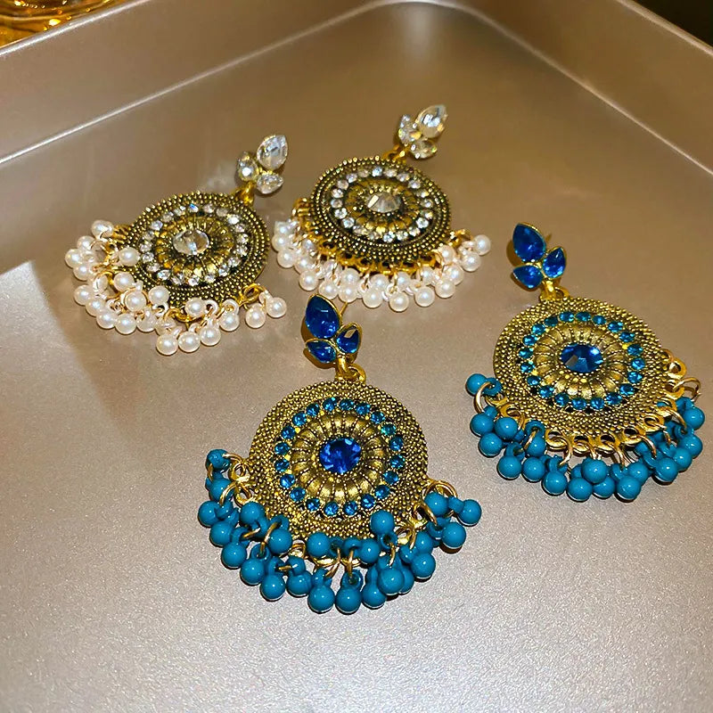 Rhinestone alloy bead dangle earrings with sparkling stones and intricate metalwork, stylish jewelry accessory.