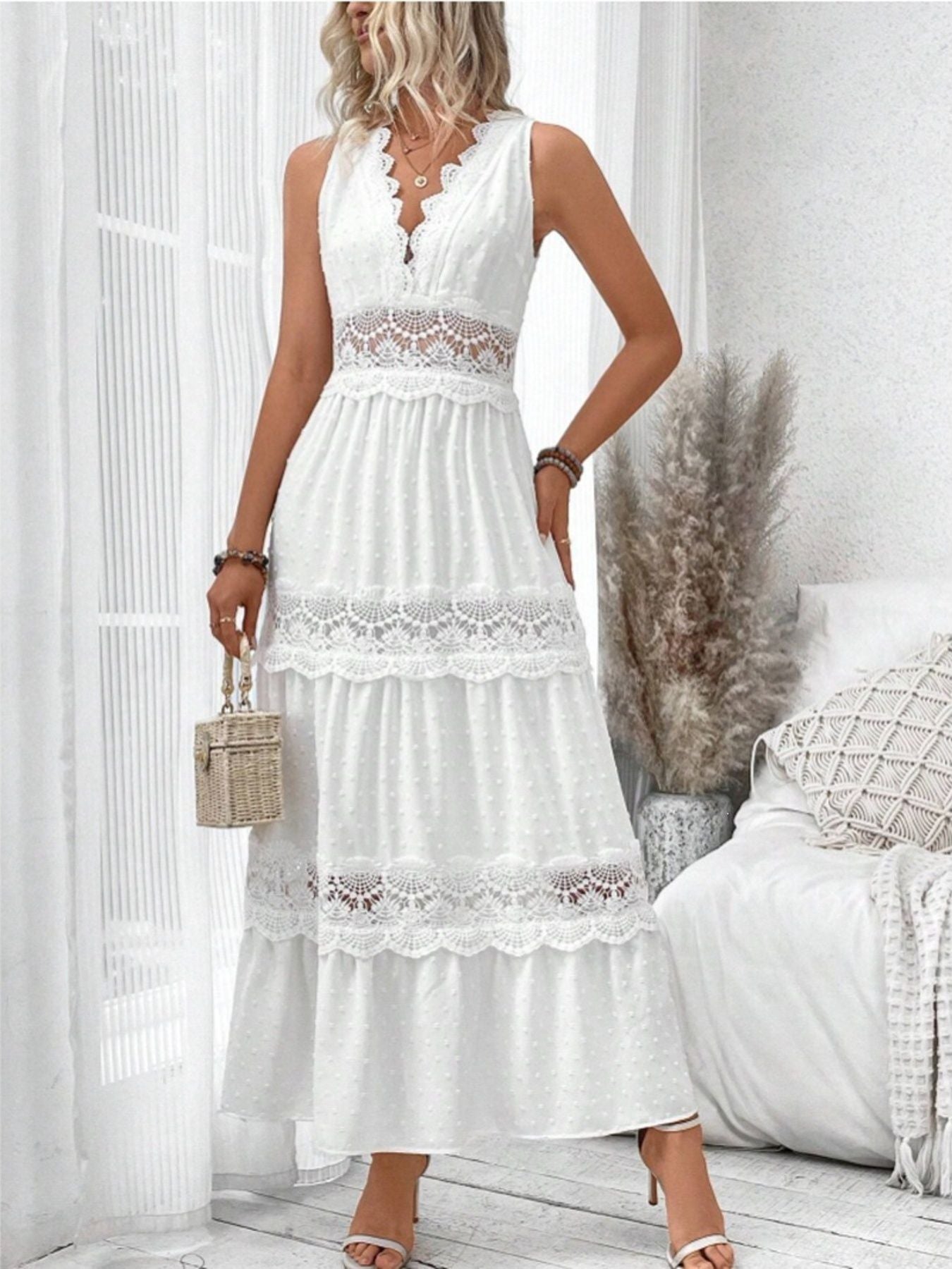 Sleeveless Swiss dot lace maxi dress with ruched tie detail, flowing silhouette and delicate fabric from Trendsi.