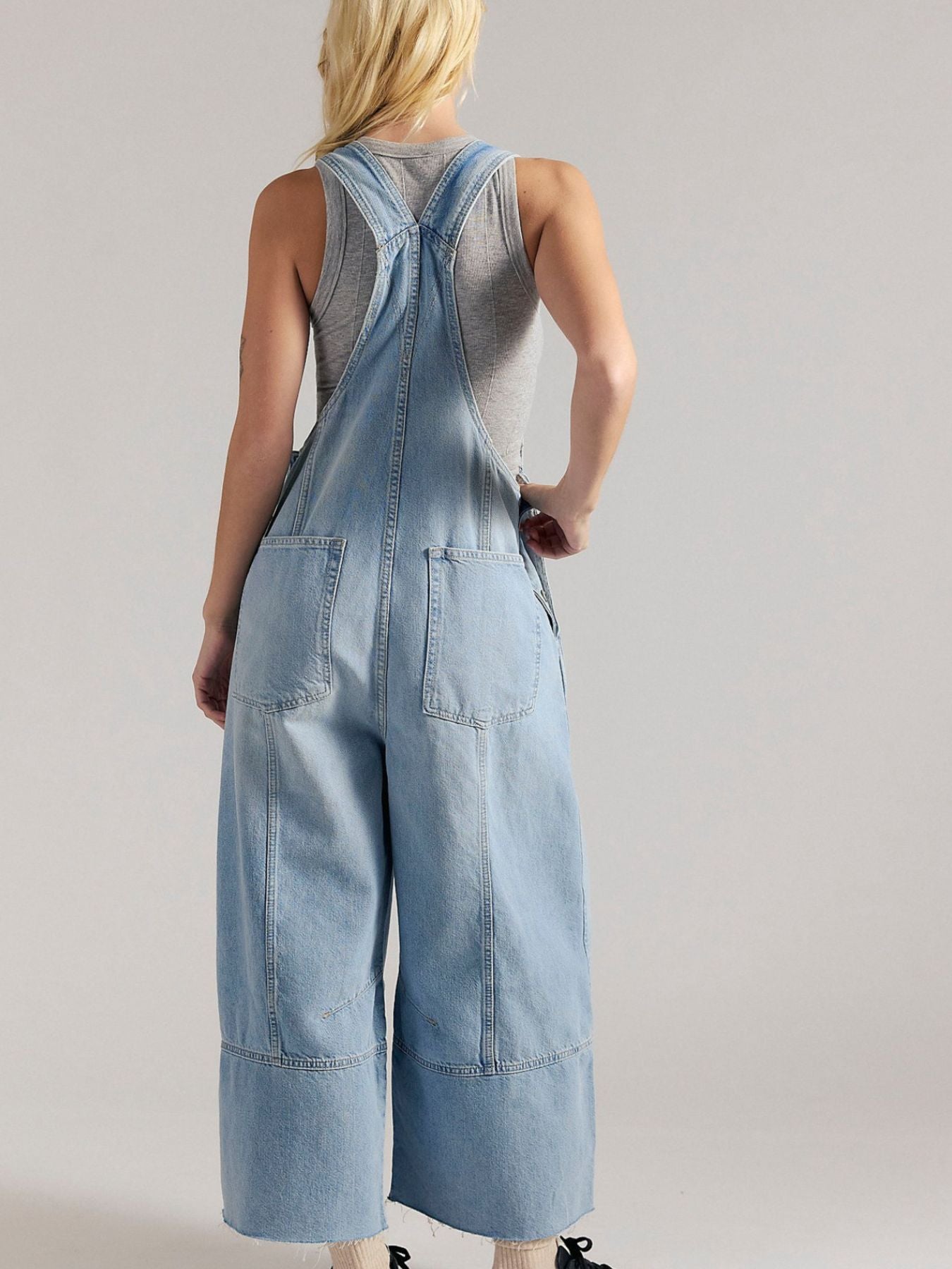 Lightweight raw hem wide-leg denim overalls jumpsuit by Trendsi featuring casual chic dungaree style and relaxed fit.