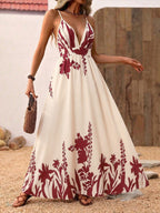 Elegant deep V-neck spaghetti strap maxi dress by Plush Fashion Hub, floor-length evening gown with a flowing silhouette.