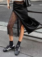 Women's elegant lace midi skirt by Trendsi featuring a sheer split detail, perfect for stylish and sophisticated looks.