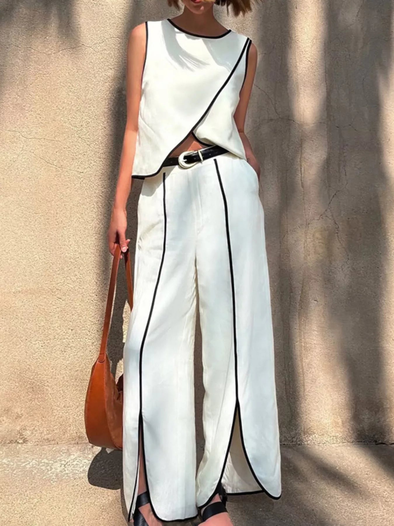 Contrast trim sleeveless top and wide-leg pants set by Plush Fashion Hub, featuring a stylish two-piece outfit with modern design.