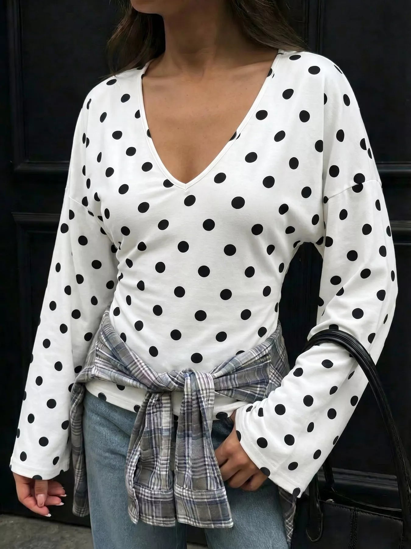 Polka dot V-neck long sleeve T-shirt by Plush Fashion Hub featuring a stylish pattern and comfortable fit.