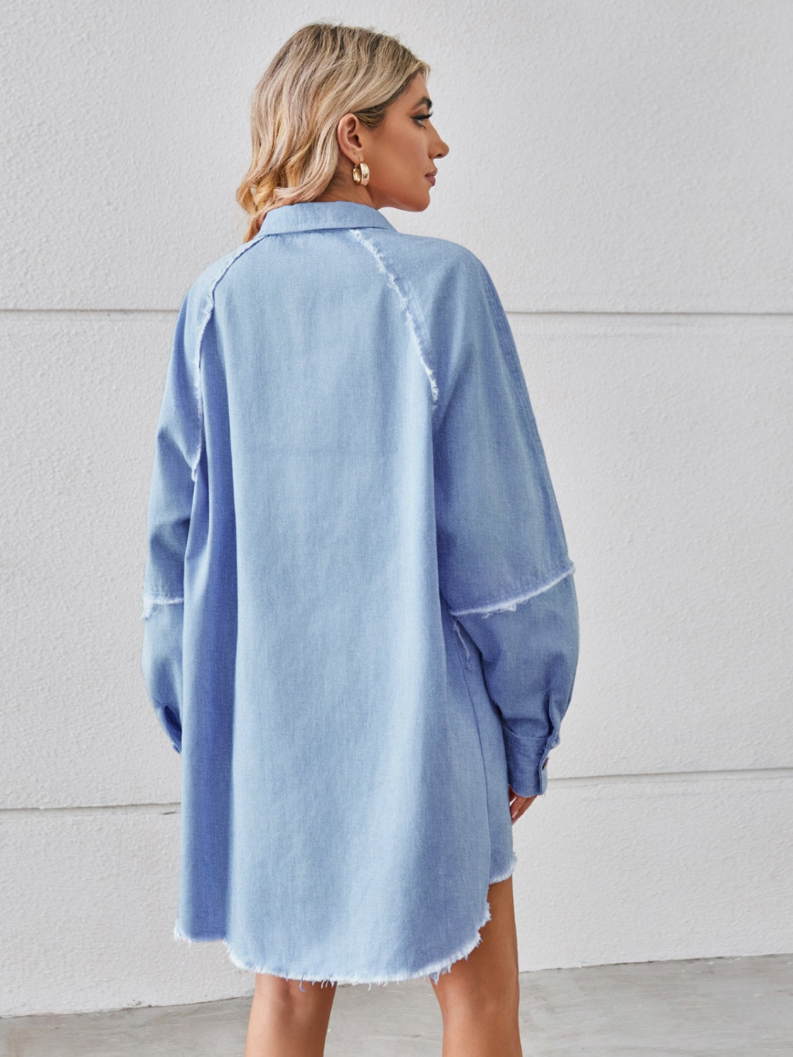 Raw hem button-up denim dress from Plush Fashion Hub featuring a classic fit and casual style.