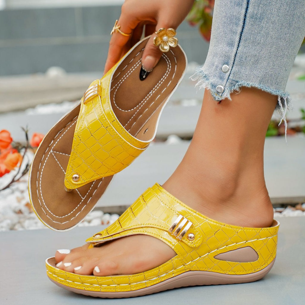Women's faux leather wedge sandals with toe post design and mid-heel, featuring a stylish and comfortable shoe by Trendsi.