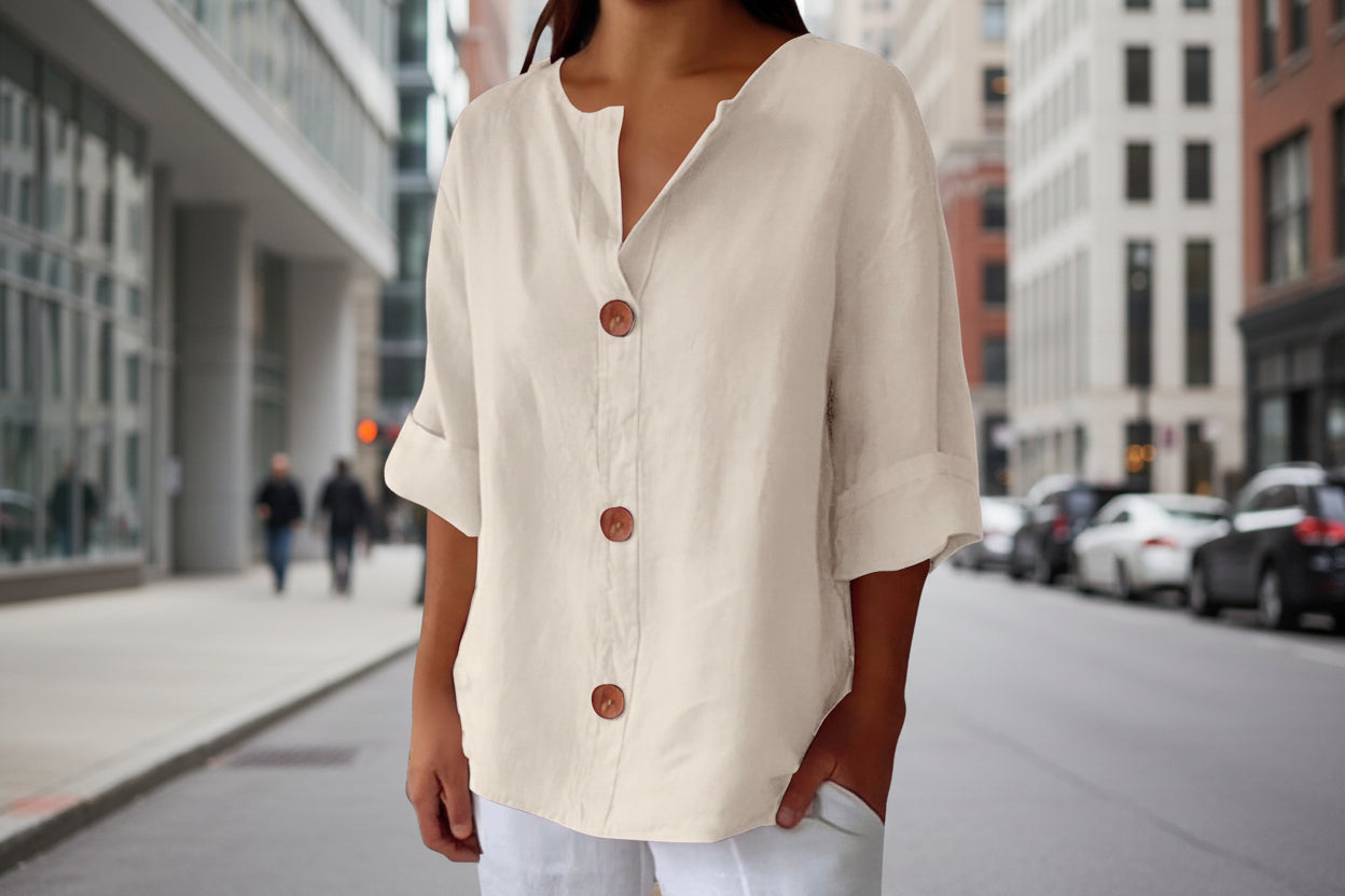 Women's V-neck buttoned blouse from FitiqueFit, casualwear style, shown in a light fabric with a relaxed fit and front button closure.