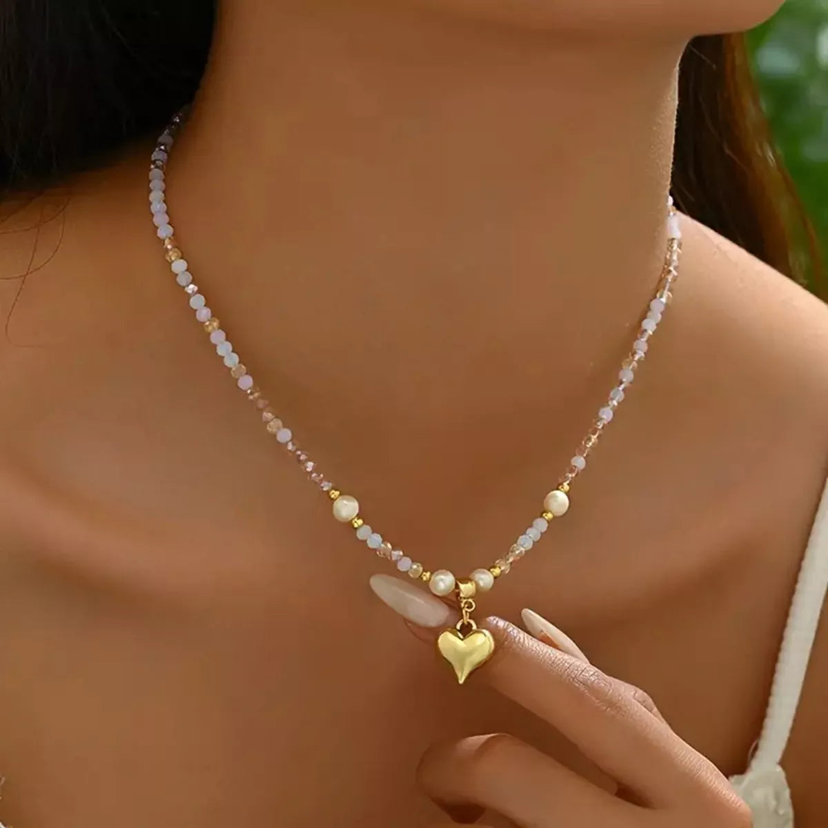 Bead heart pendant necklace by Plush Fashion Hub featuring colorful beaded heart charm on a delicate chain.