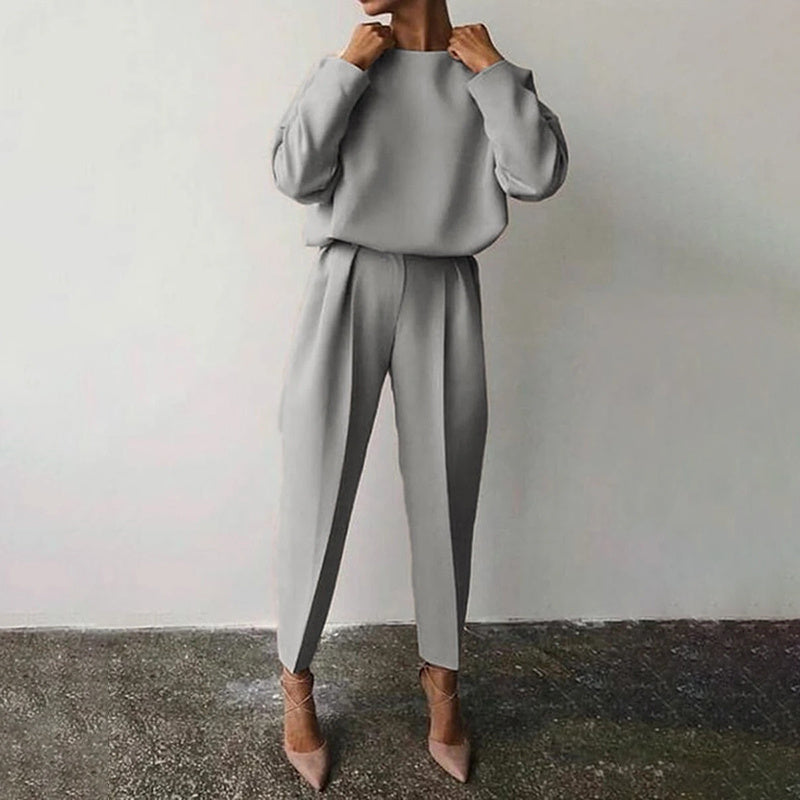 Women’s solid color 2-piece loungewear set by Plush Fashion Hub, long sleeve top and pleated pants for casual wear.