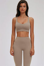 Fitglutes Activewear sports bra and leggings 2-piece set, kinetic cross-back design, suitable for gym and workout activities.