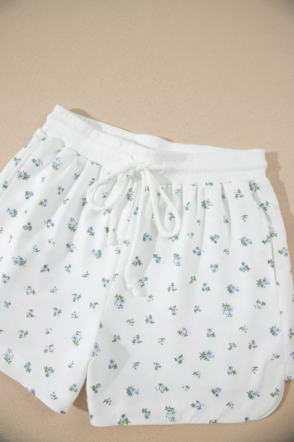 Floral print half zip top and matching short set by Shopimist, featuring vibrant flower patterns and casual summer style.