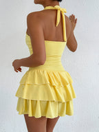 Halter neck ruffle layered dress from Plush Fashion Hub featuring a stylish design and flowing fabric, perfect for casual events.