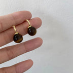 Shopimist Tiger Eye Ball Drop Earrings featuring polished golden-brown tiger eye stones hanging from elegant hooks.