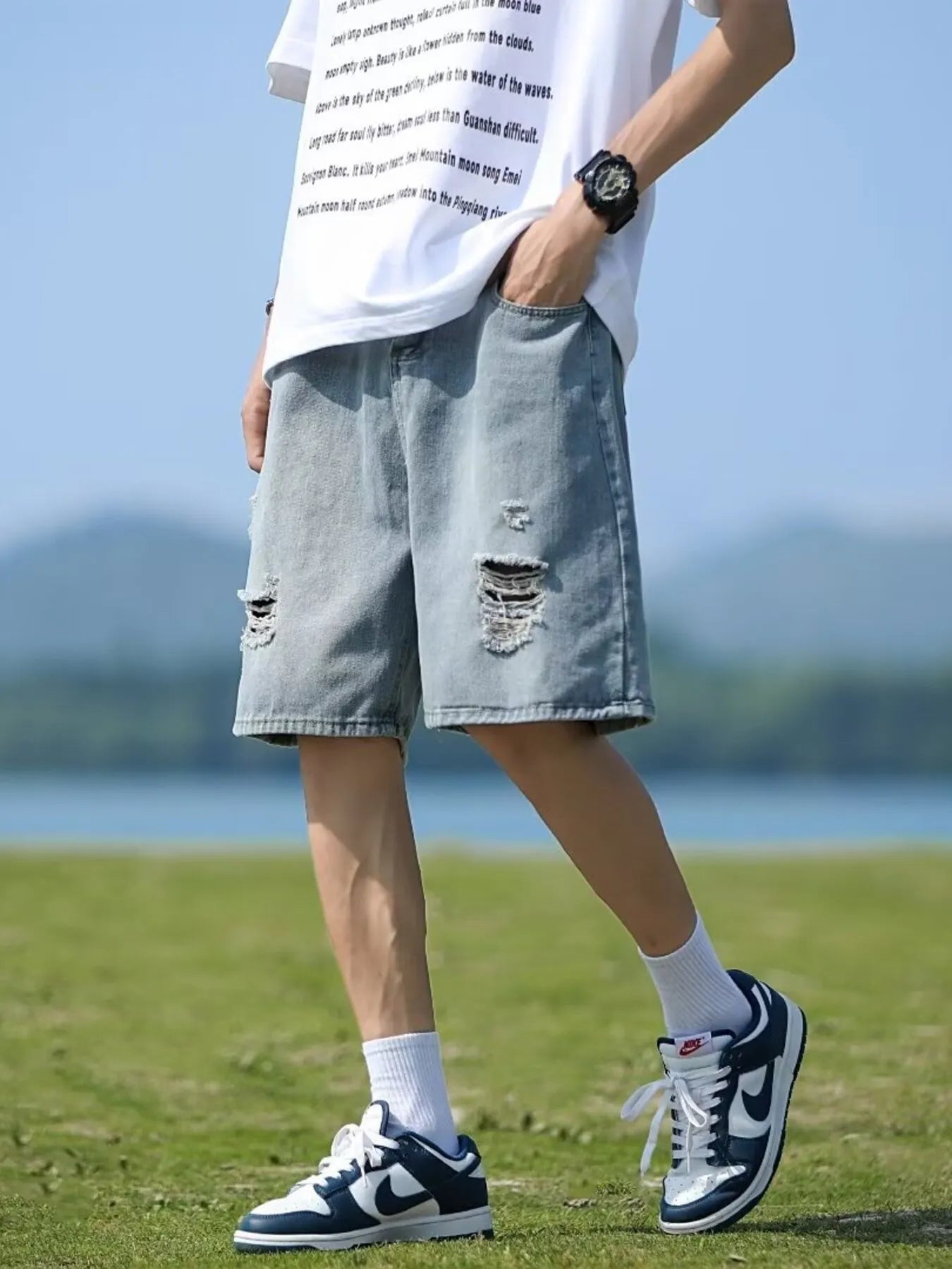 Men's loose fit ripped denim shorts by Plush Fashion Hub, casual plus size bottoms with distressed details and relaxed style.