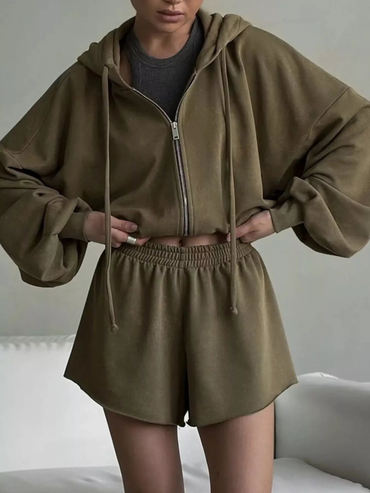 Plush Fashion Hub zip-up long sleeve outerwear and matching shorts set, shown with the shorts laid out on a surface.