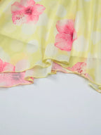 Sheer floral print sleeveless asymmetrical mini dress by Shopimist, showcasing delicate fabric and stylish design.