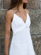 Women's ruffled V-neck cotton maxi dress by Trendsi featuring a flowy boho style and lightweight fabric, perfect for summer wear.