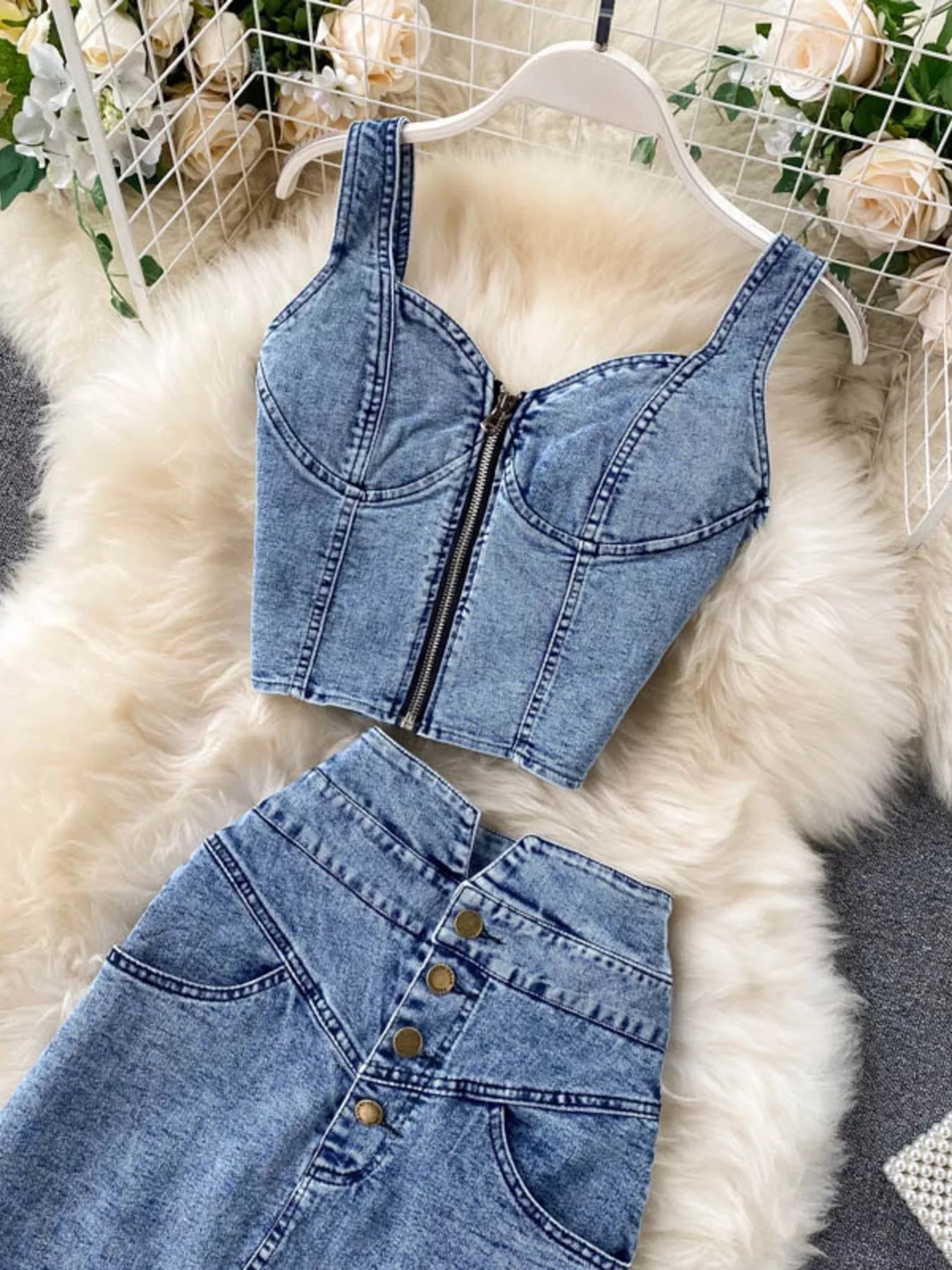 Denim set featuring a zipper top and button slit skirt from Shopimist, shown in a stylish, casual outfit with detailed stitching.