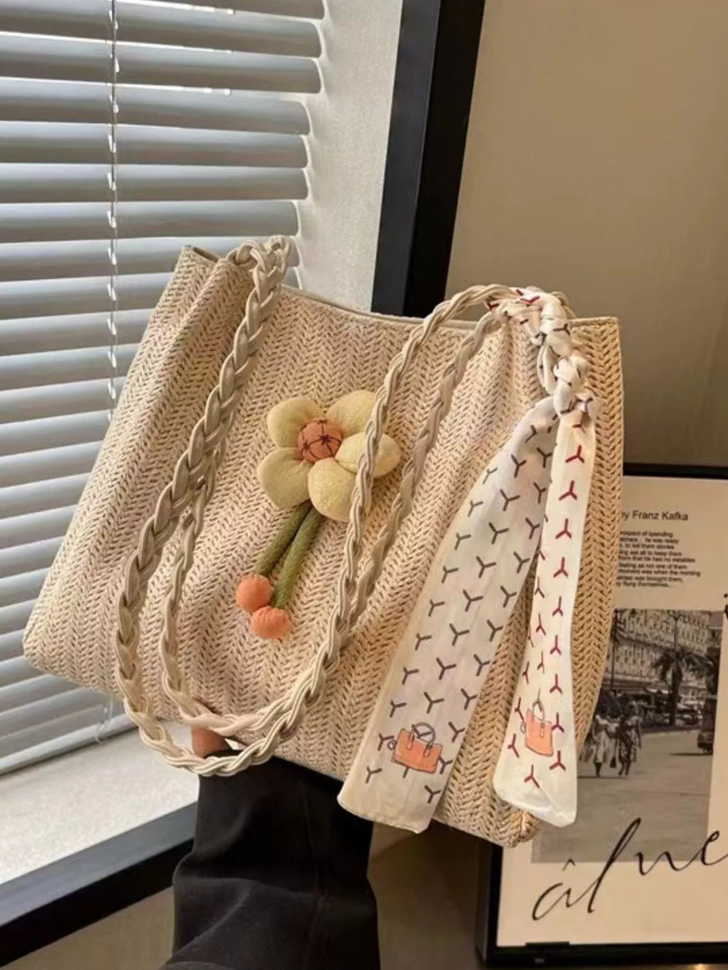 Woven straw tote bag with floral decor, natural material, and sturdy handles, perfect for casual outings and summer style.