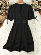 Lace detail v-neck mini dress from Shopimist featuring delicate lace accents and a flattering V-neck design.