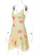 Sheer floral print sleeveless asymmetrical mini dress by Shopimist, featuring a lightweight fabric and stylish design.