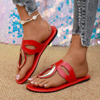 Women's open toe low heel sandals with golden accent detail, stylish Trendsi shoe featuring a comfortable heel and elegant design.