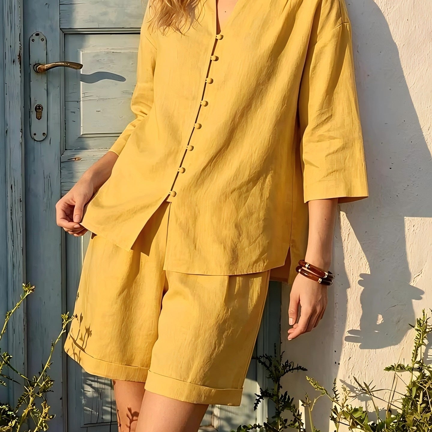 Women's V-neck top and high-waist wide-leg shorts two-piece casualwear set by FitiqueFit, featuring a stylish V-neck top and relaxed shorts.