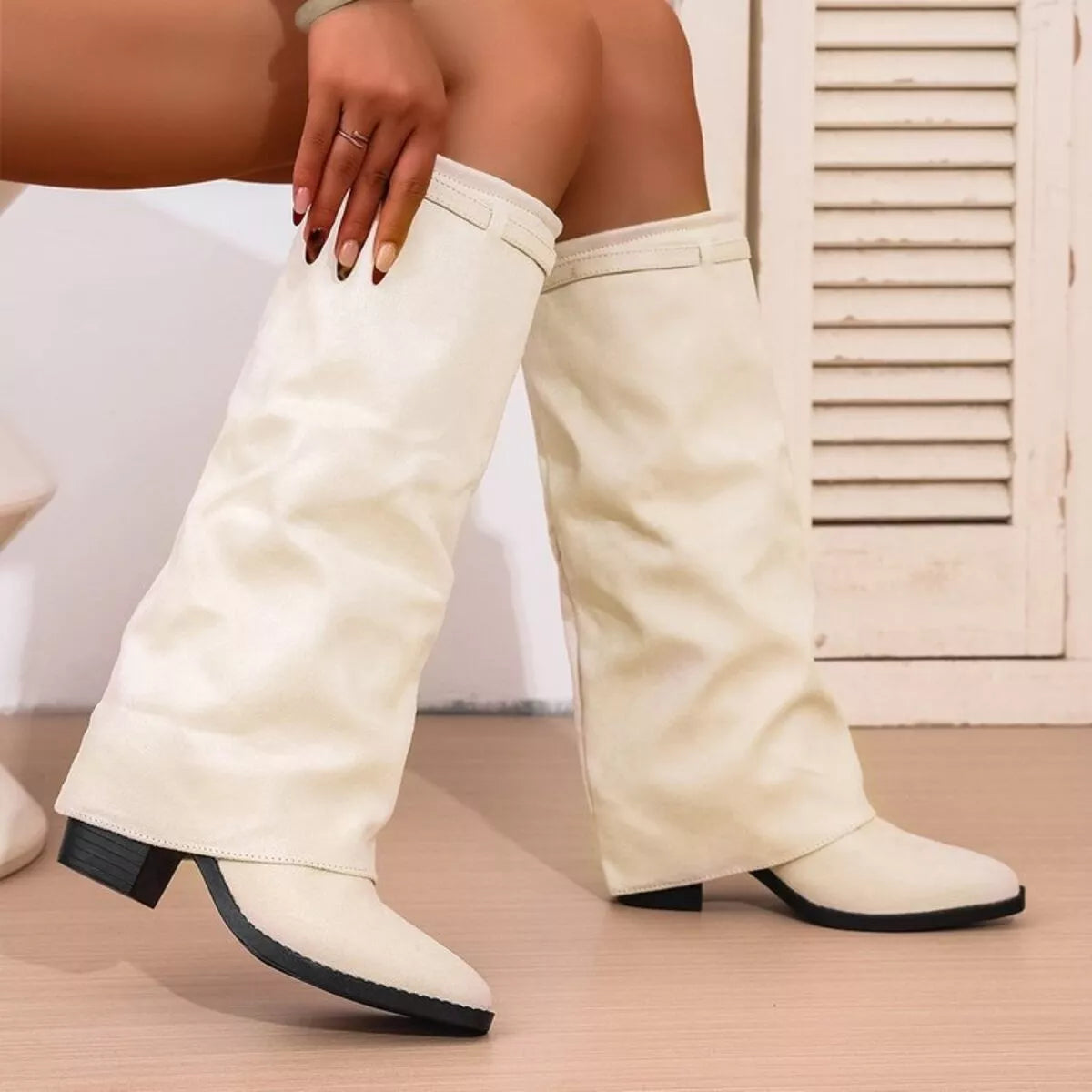 Point toe block heel boots by Trendsi featuring sleek footwear design with stylish pointed toes and sturdy block heels.