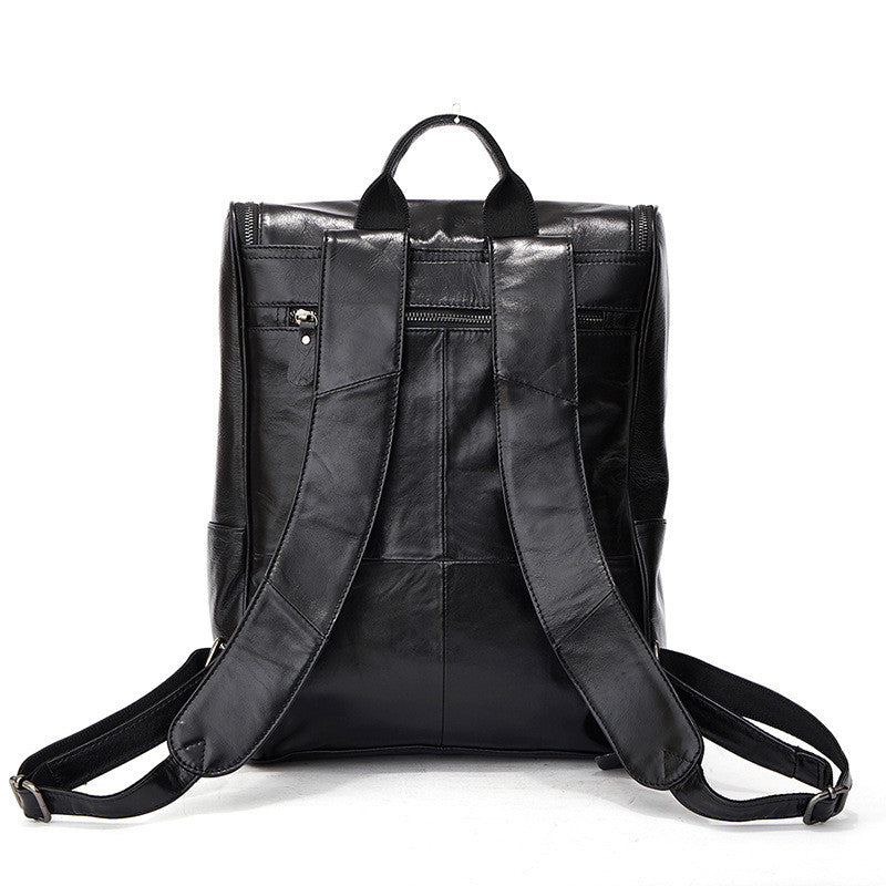 Black leather computer backpack with first layer leather, plush design from Plush Fashion Hub, featuring multiple compartments and padded straps.