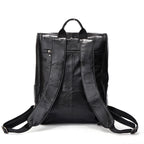 Black leather computer backpack with first layer leather, plush design from Plush Fashion Hub, featuring multiple compartments and padded straps.