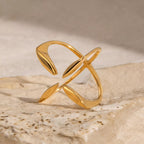 Stainless steel crisscross open ring by Shopimist featuring a sleek, modern design with intertwined bands and a polished finish.