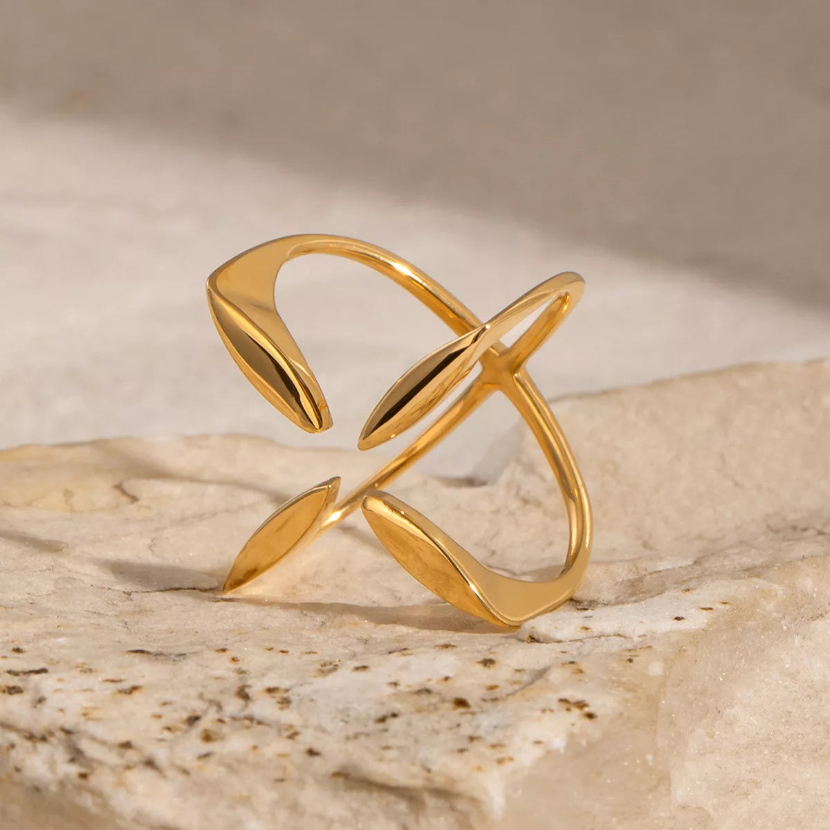 Stainless steel crisscross open ring by Shopimist featuring a sleek, modern design with intertwined bands and a polished finish.