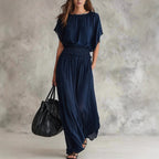 Women's chiffon high-waist ruched maxi dress by FitiqueFit, flowing fabric, sleeveless design, and elegant draping.