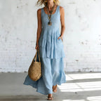 Women’s cotton linen sleeveless loose maxi dress by FitiqueFit, casualwear, flowing fabric and relaxed fit in natural light.