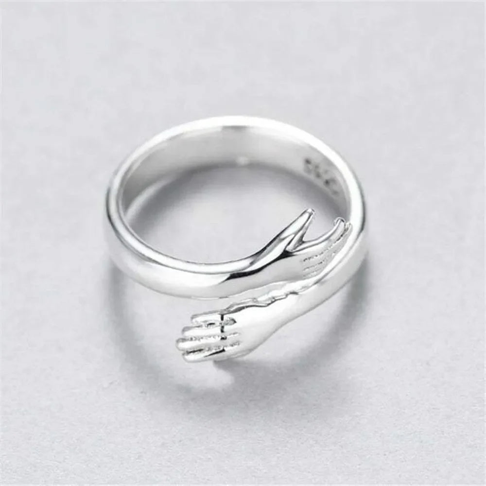 Sterling silver Hug Shape bypass ring with smooth, polished finish, designed for comfortable wear and elegant style.
