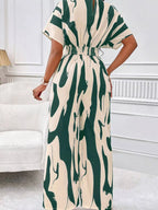 Abstract print wide-leg jumpsuit by Trendsi, featuring a flowing design and stylish pattern perfect for casual or chic occasions.